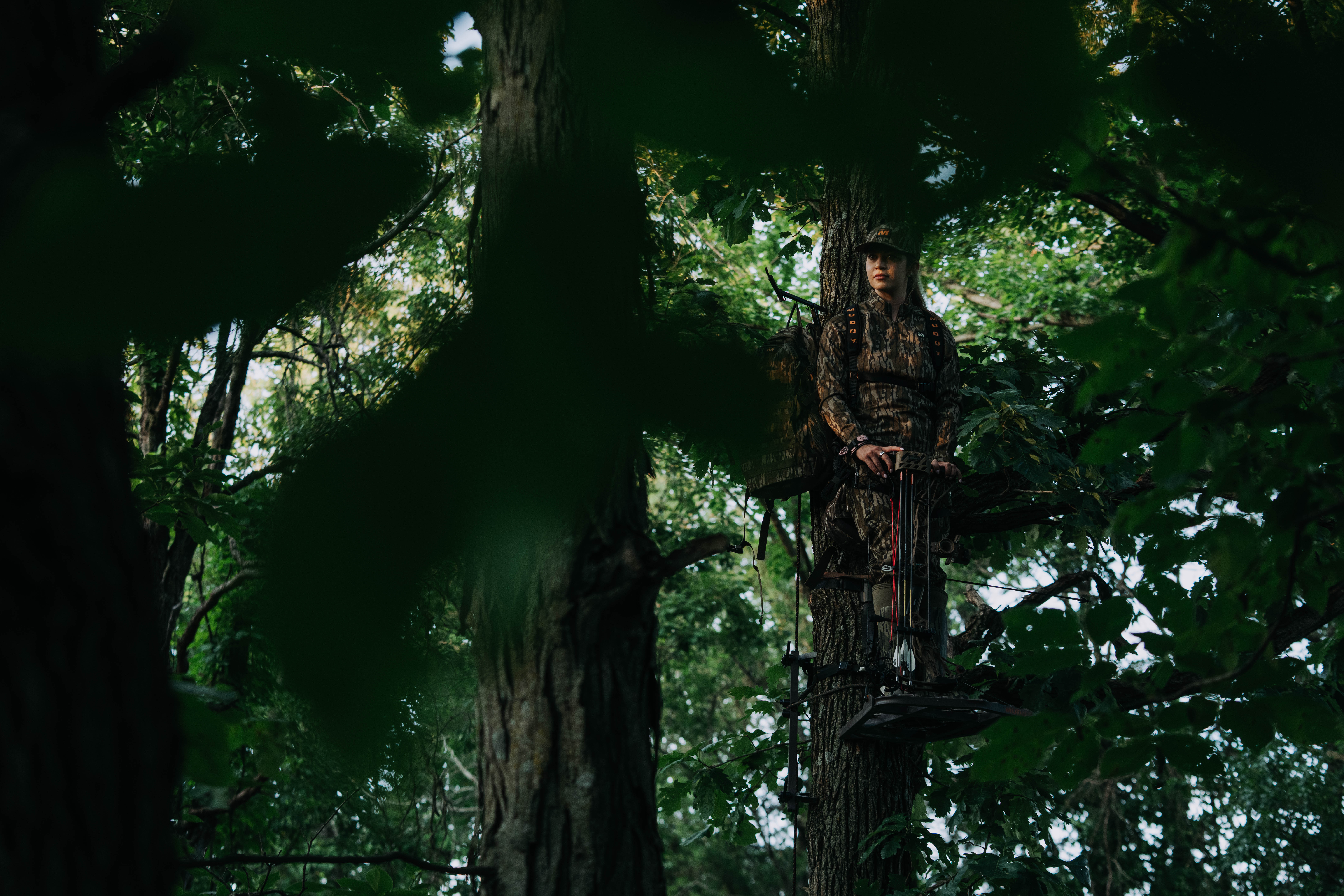 Woman hunter wearing Muddy camo in the field